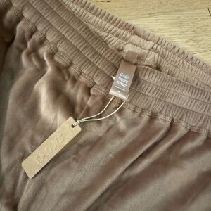 Skims track pants